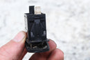 Black plastic electrical switch.