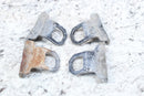 Four weathered metal tow hooks.