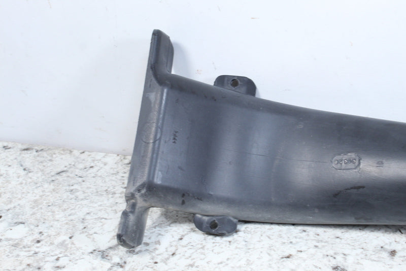 Gray plastic automotive part.