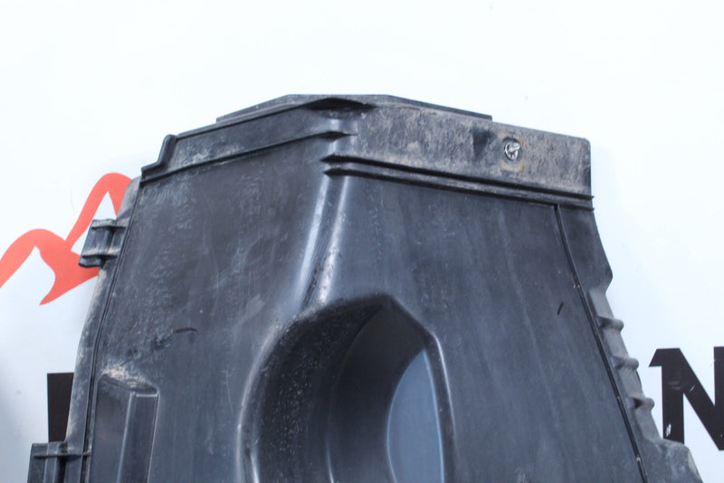Black plastic air filter housing.