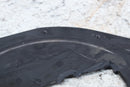 Black plastic fender liner.