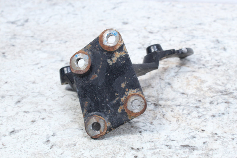 Black metal mounting bracket with rust.