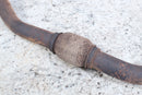 Rusty exhaust pipe with flex joint.