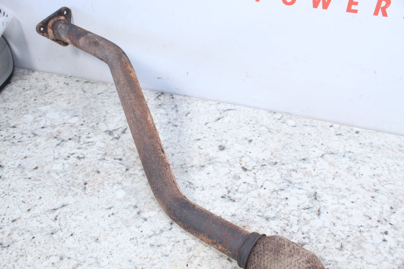 Rusty, bent exhaust pipe.