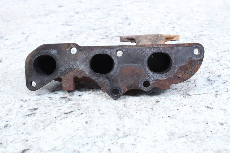 Used, rusty exhaust manifold.