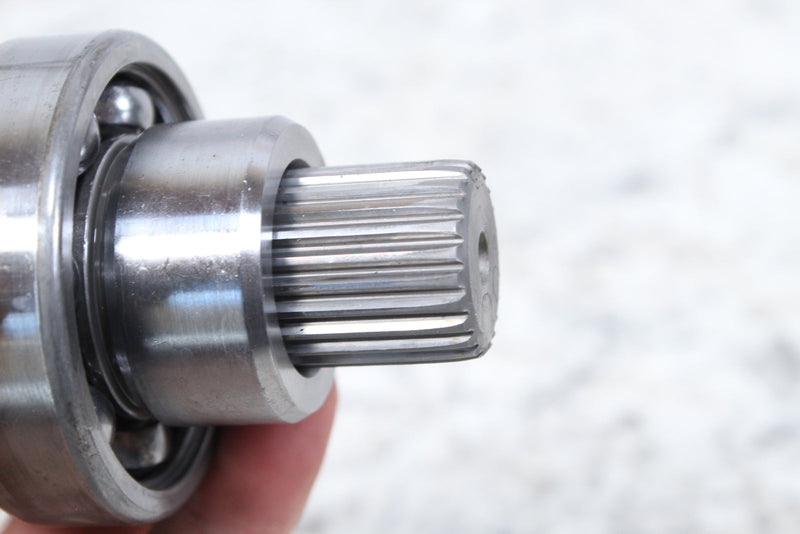 Splined metal shaft with bearing.