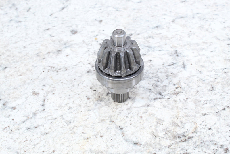 Metal starter motor gear.