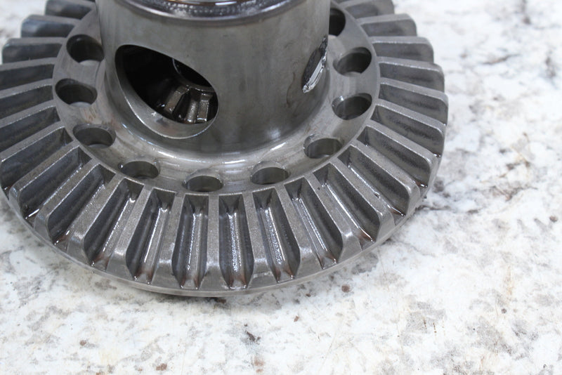 Shiny metal gear with angled teeth.