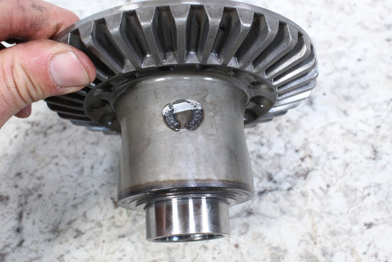 Metal gear with cylindrical base.