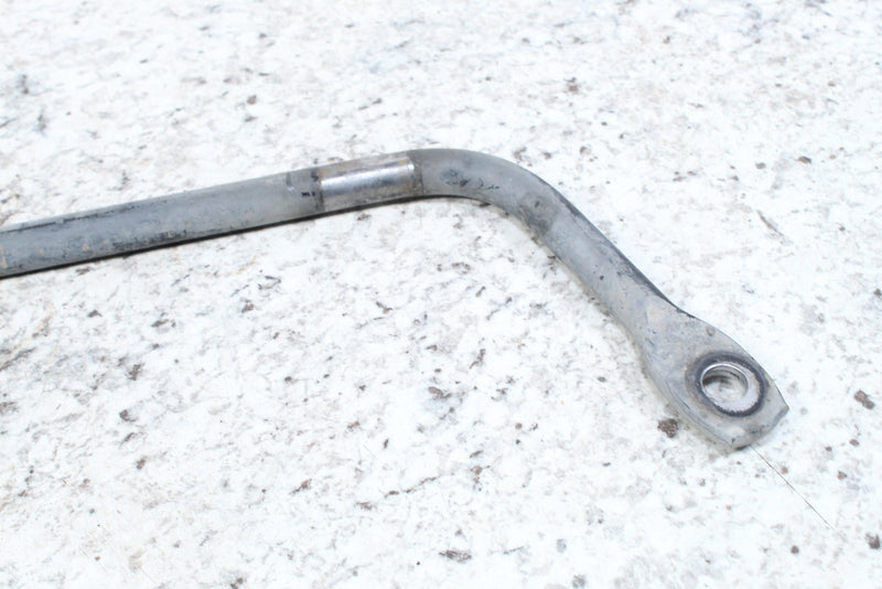 Bent metal bar with mounting hole.