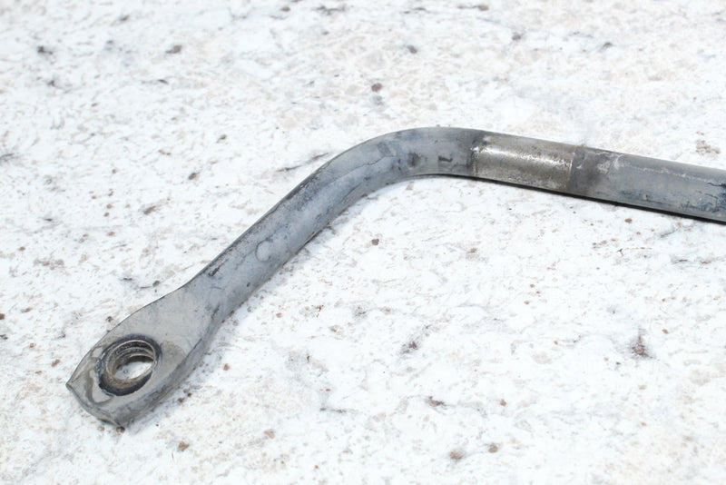 Bent metal rod with threaded hole.