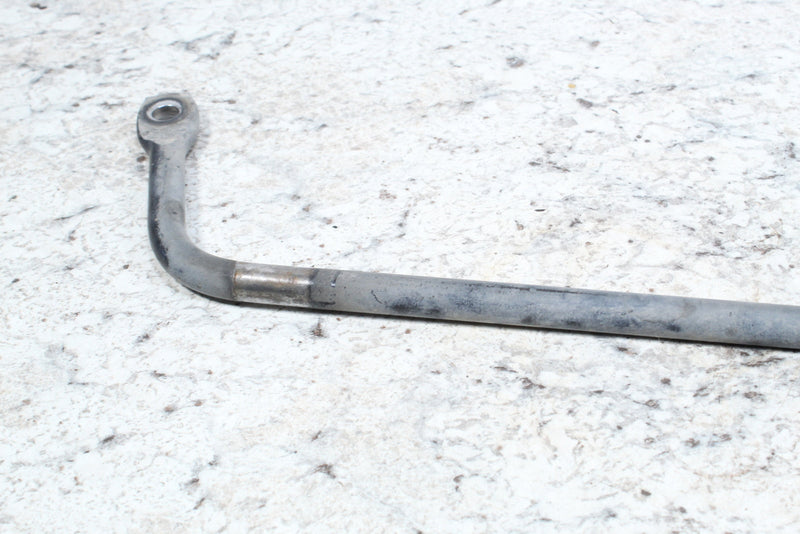 Gray metal rod with eyelet.