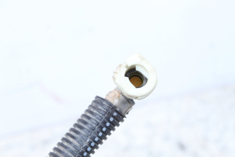 Corrugated hose with a white plastic elbow fitting.