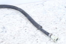 Corrugated black hose with white connector.