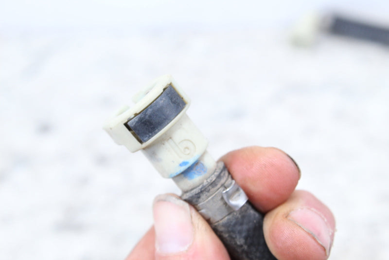 Fuel line connector with hose.