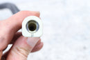 White plastic hose connector.
