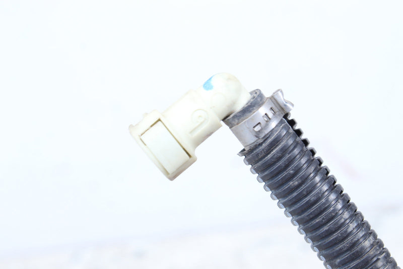 Corrugated hose with a white plastic elbow connector and metal clamp.