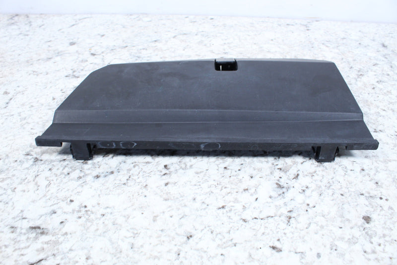 Black plastic car part.