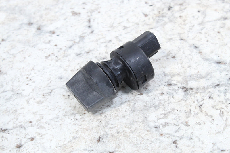 Black plastic automotive sensor.