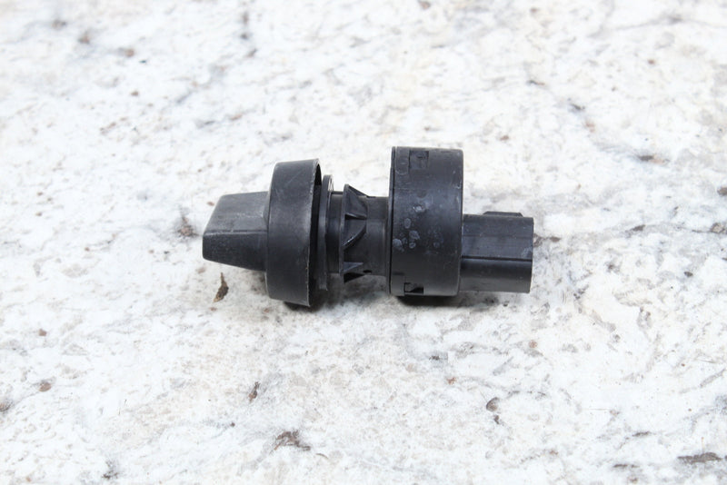 Black plastic automotive sensor.