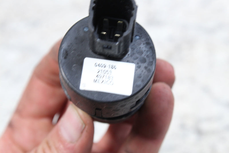 Black electrical component with connector.