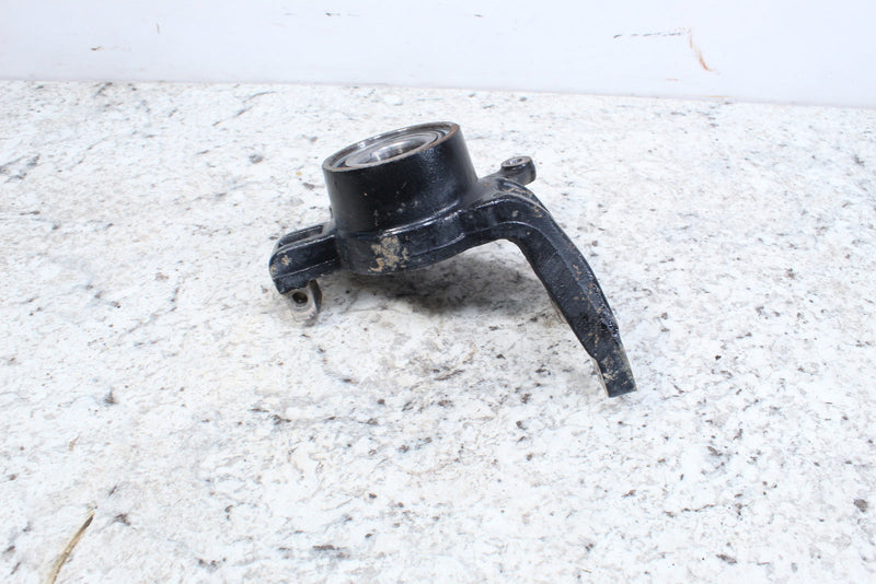 Black metal steering knuckle.