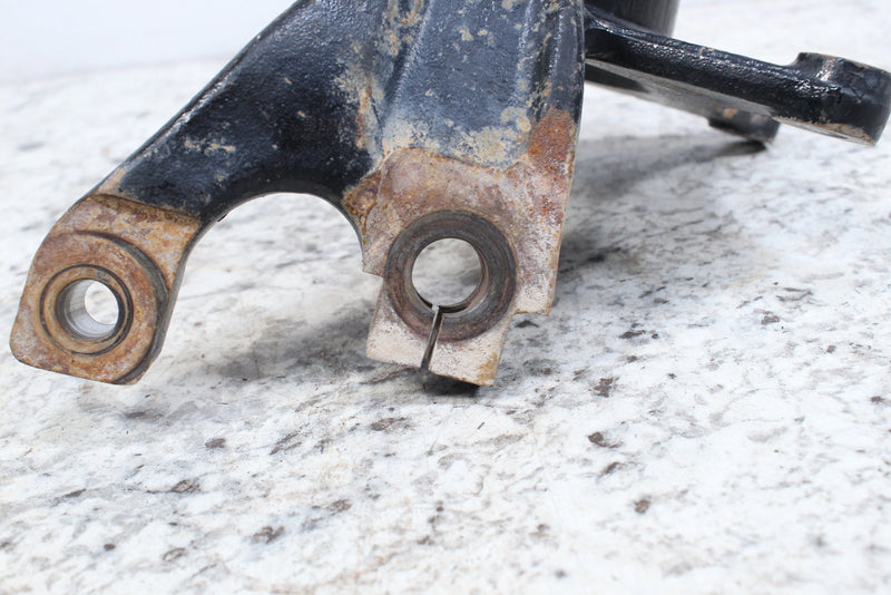 Black metal mechanical component with worn bushings.