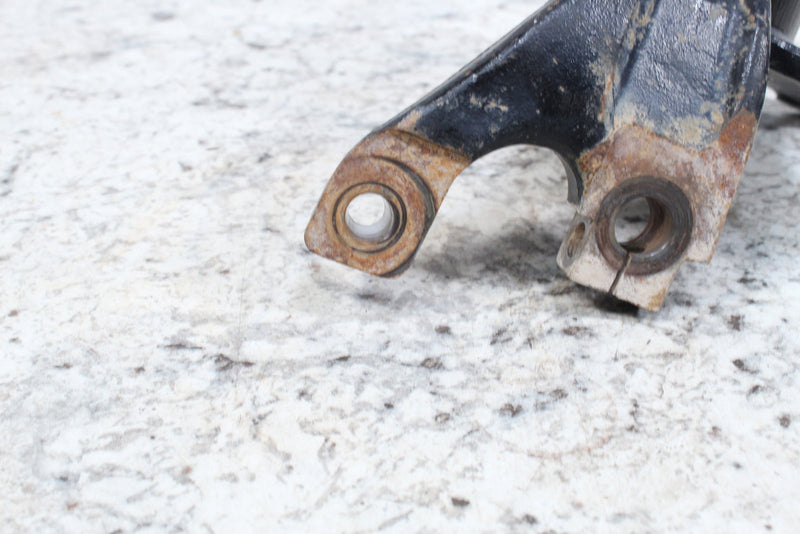 Black metal bracket with bushings.