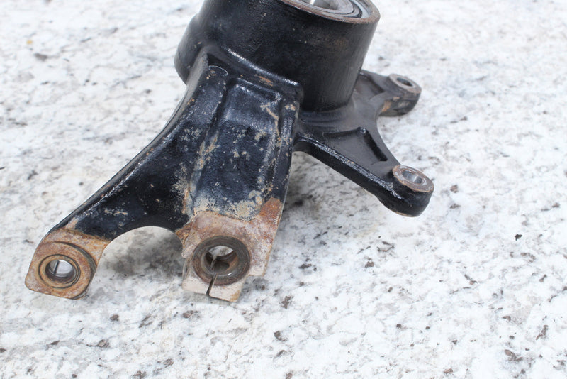 Black metal steering knuckle.