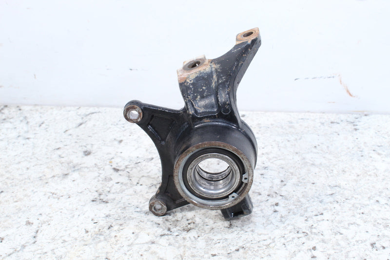 Black metal steering knuckle.