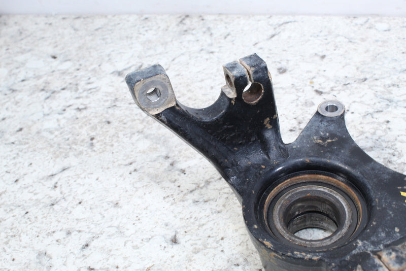 Black metal steering knuckle.