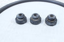 Three worn rubber bushings.