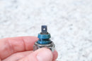 Oil pressure sensor with a blue plastic collar.