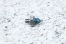Silver and blue pressure sensor.