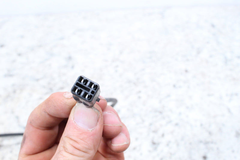 Gray six-pin electrical connector.