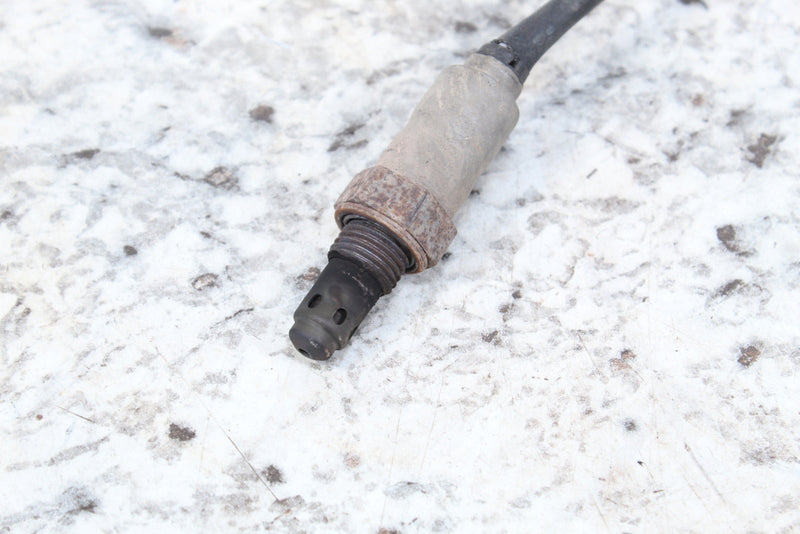 Used oxygen sensor with threaded base.