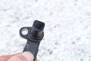 Black plastic sensor with mounting hole.