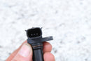 Black plastic sensor with three pins.