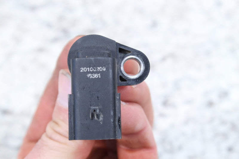 Black plastic sensor with mounting hole.