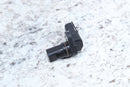 Black plastic automotive sensor.