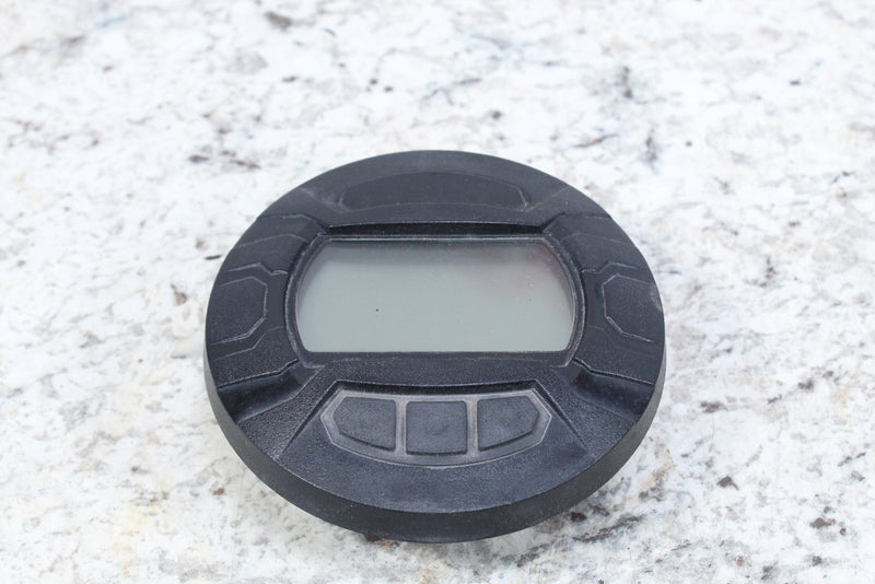 Round black digital display.