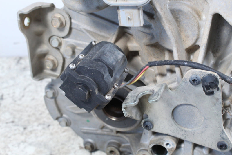 Used automotive part with electrical components.