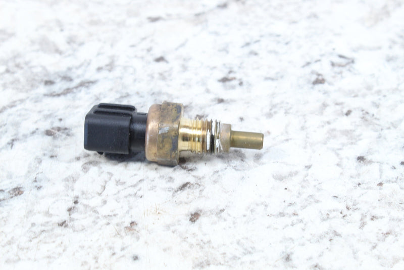 Automotive temperature sensor with electrical connector.