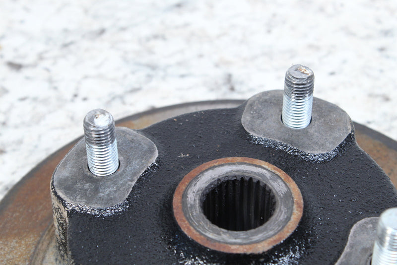 Automotive wheel hub with studs.