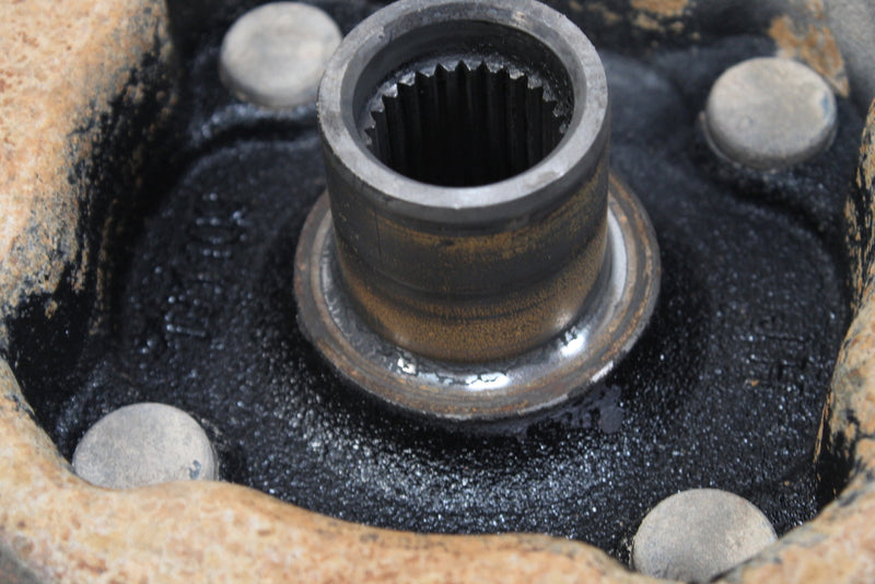 Greasy metal hub with splines.