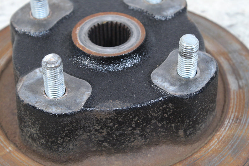 Black metal hub with studs.