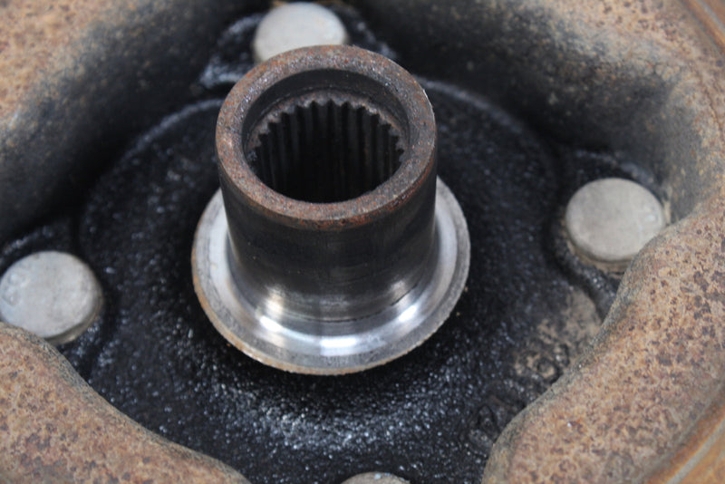Splined metal shaft with flange.