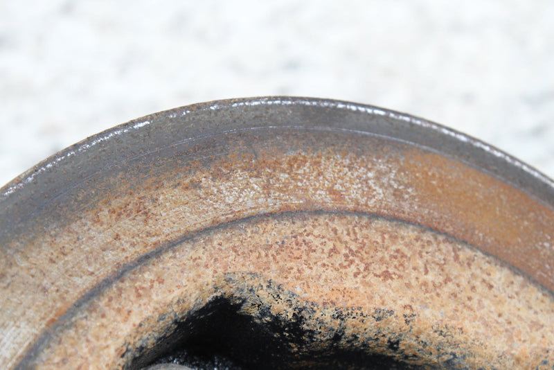 Rusty, worn metal ring.