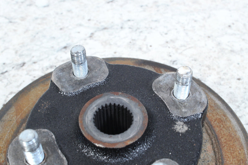 Automotive wheel hub with studs.