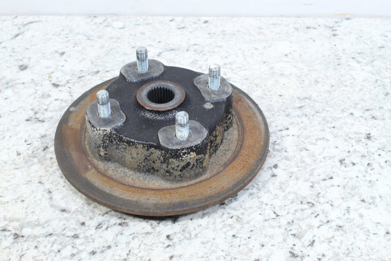 Rusty metal wheel hub with studs.